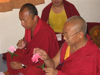 Tibetan monks Ngawang Gyatso (left) and Yehi Choephel discuss how our senses distinguish between living and non-living t